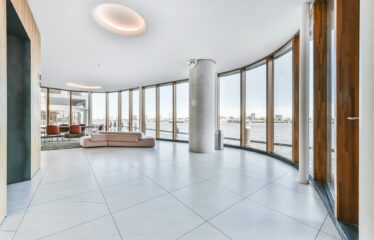 Luxury apartment building hallway with cityscape view